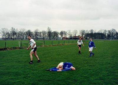 4 men playing football
